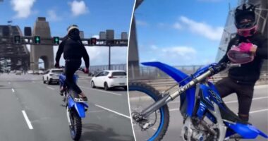 Chilling footage shows dirt bike riderâs ârecklessâ act on busy bridge: âDeath-defying stuntsâ
